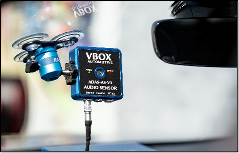 Photograph of the ADAS Audio Sensor mounted to a windscreen.