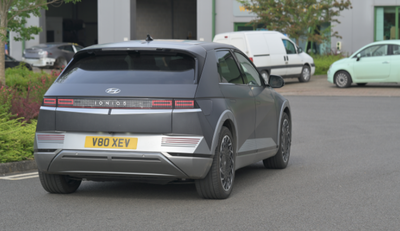 Photograph of a car exiting a car park.