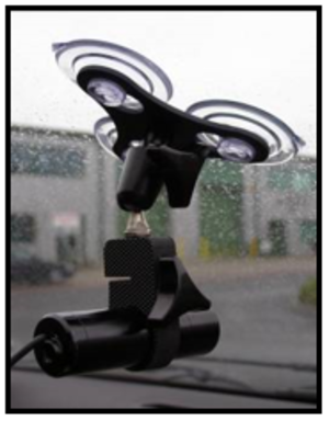 Photograph of a camera mounted in the windscreen using a suction mount.