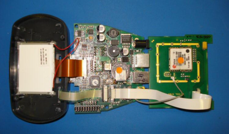 Rear casing removed and PCB laid flat on table surface. 