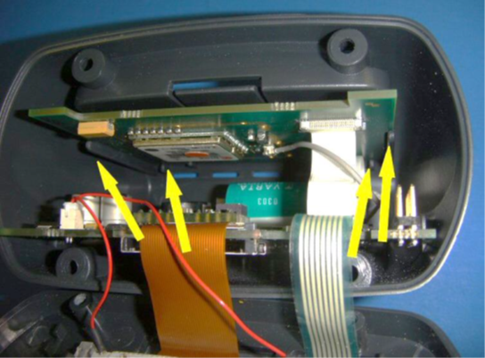 PCB placed back in the rear casing, with arrows indicating the slots it must be placed into.
