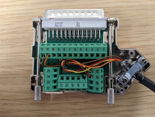 Image of the open 25-pin terminal connector block on the RLCAB119 with the cable for the IMU already wired in. 