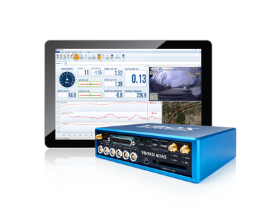 Photograph of a VBOX 3i ADAS unit in front of a tablet.