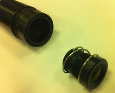 Photograph of the old lens separate from the camera body.